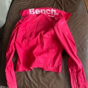 Bench woman’s pink jacket